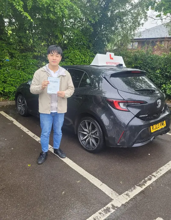 Student celebrating after a driving test pass