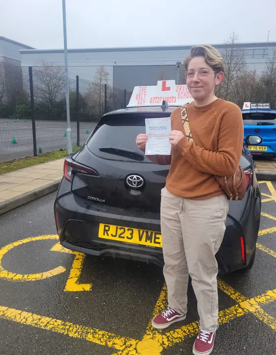 Student celebrating after passing their driving test