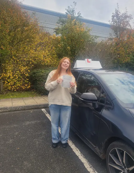 Student celebrating a driving test pass